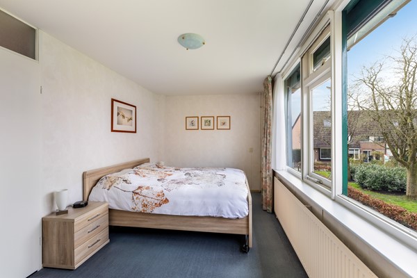 Foto - Te koop: tussenwoning gelegen aan groenvoorziening